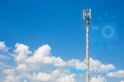 Communication Antenna Repeater Tower On Blue Sky Background Stock Photo