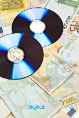 Compact Disks With Euro Money Stock Photo