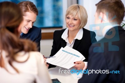 Company Discussion Going On In A Meeting Hall Stock Photo