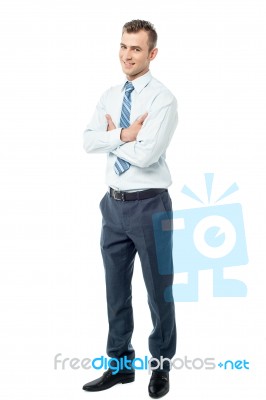 Confident Business Man With Arms Crossed Stock Photo