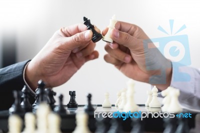 Confident Businessman Colleagues Playing Chess With Colleague To… Stock Photo