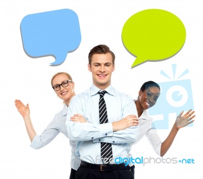 Confident Businessman Posing With Colleagues Stock Photo