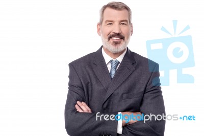 Confident Businessman With Folded Arms Stock Photo