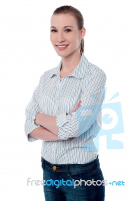 Confident Businesswoman With Folded Arms Stock Photo