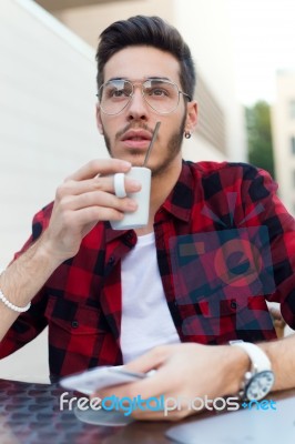 Confident Entrepreneur Drinking Coffee Focused In Something Stock Photo