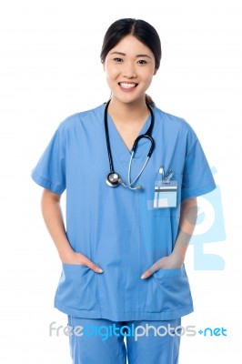 Confident Female Doctor In Medical Uniform Stock Photo