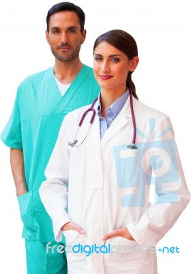 Confident Female Doctor Standing With Male Surgeon Stock Photo