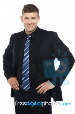 Confident Young Businessman Posing Casually Stock Photo