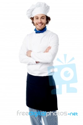 Confident Young Chef Posing In Uniform Stock Photo