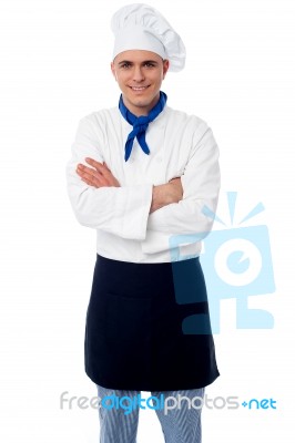 Confident Young Chef With Arms Crossed Stock Photo