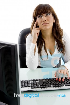 Confused Businesswoman In Office Stock Photo