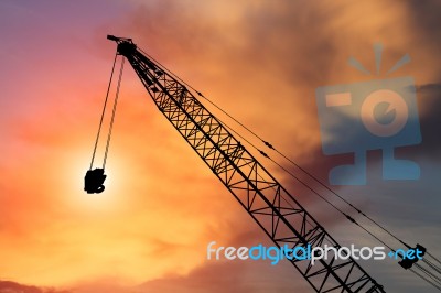 Construction Crane On Evening Background Stock Photo