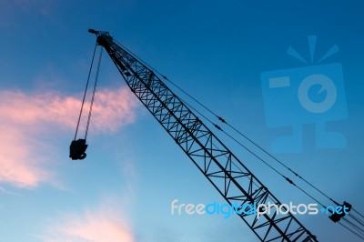 Construction Crane On Evening Background Stock Photo