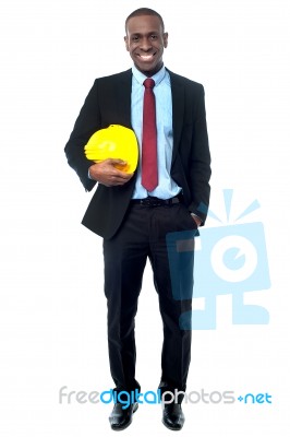 Construction Engineer Holding Hard Hat Stock Photo