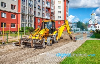 Construction Of A New Road. Excavator Prepares The Surface Stock Photo