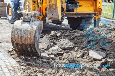 Construction Of A New Road. Excavator Prepares The Surface Stock Photo