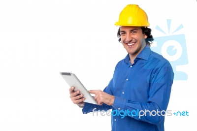 Construction Worker Operating Tablet Pc Stock Photo