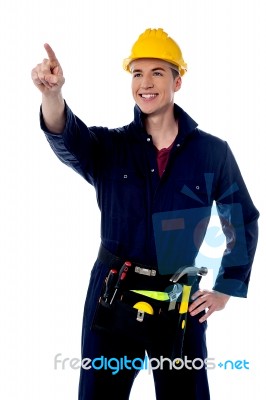 Construction Worker Pointing And Looking Away Stock Photo