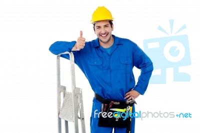 Construction Worker Posing With Step Ladder Stock Photo