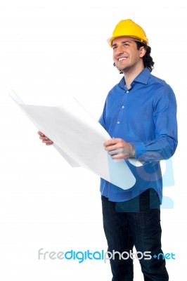 Construction Worker Reviewing Blueprint Stock Photo