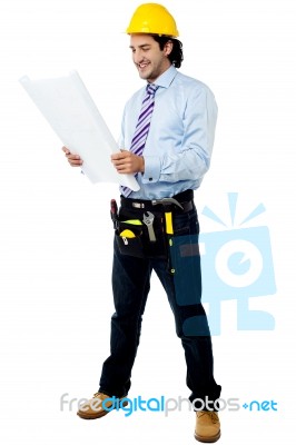 Construction Worker Reviewing Blueprint Stock Photo