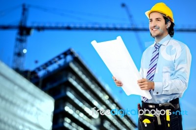 Construction Worker Reviewing Blueprint Stock Photo