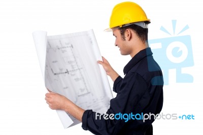 Construction Worker Reviewing Plan Stock Photo