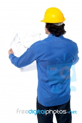 Construction Worker With Blueprint Plan Stock Photo