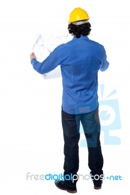 Construction Worker With Blueprint Plan Stock Photo