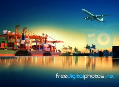 Container Ship In Import,export Port Against Beautiful Morning Light Of Loading Ship Yard Use For Freight And Cargo Shipping Vessel Transport Stock Photo