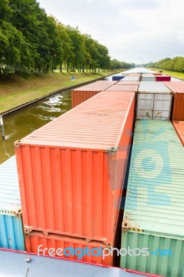 Containers On  Ship In River Stock Photo