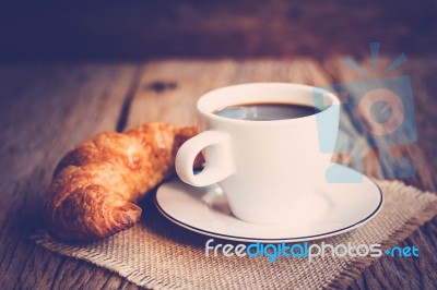 Continental Breakfast With Coffee And Croissant Stock Photo