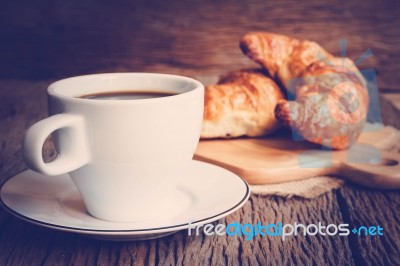 Continental Breakfast With Coffee And Croissant Stock Photo