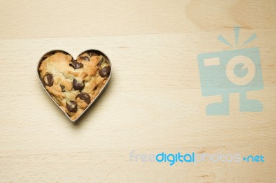 Cookie In Heart Shape On Wooden Table Stock Photo