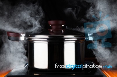 Cooking Food With Hot Stream Power Of Stanless Steel Pot On Elec… Stock Photo