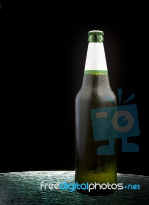 Cool Beer Bottle On Table Stock Photo