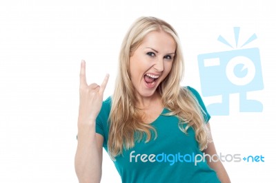 Cool Caucasian Showing Rock On Gesture Stock Photo