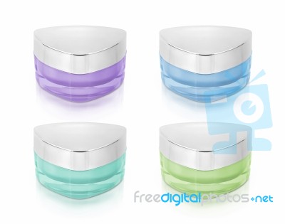 Cool Color Triangle Cosmetic Jar On White Background Stock Photo