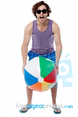 Cool Guy Playing With Beach Ball Stock Photo