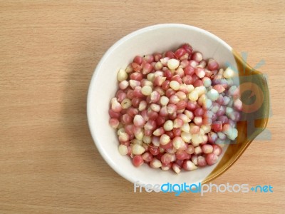 Corn In Ceramic Bowl On Wood Table Top View Stock Photo