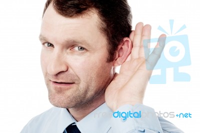 Corporate Executive Hold Hand Near Ear Stock Photo