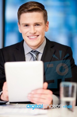 Corporate Guy Browsing On Tablet Pc Stock Photo