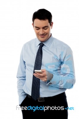 Corporate Guy Sending Emails From Phone Stock Photo