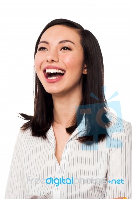 Corporate Lady Looking Up And Laughing Stock Photo