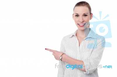 Corporate Lady Pointing At Something Stock Photo