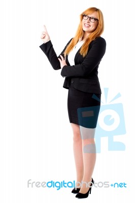 Corporate Lady Pointing Upwards Stock Photo