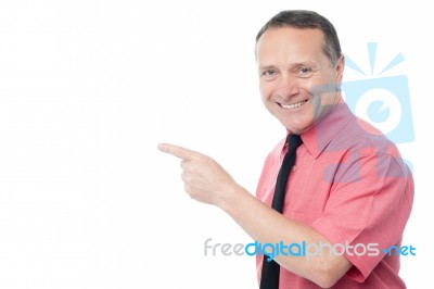 Corporate Male Executive Pointing Away Stock Photo