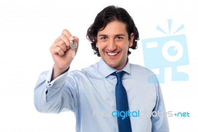 Corporate Male Offering You Office Key Stock Photo