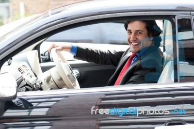 Corporate Man Driving His Car Stock Photo