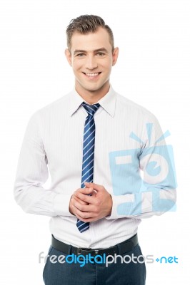 Corporate Man Posing With Clasped Hands Stock Photo